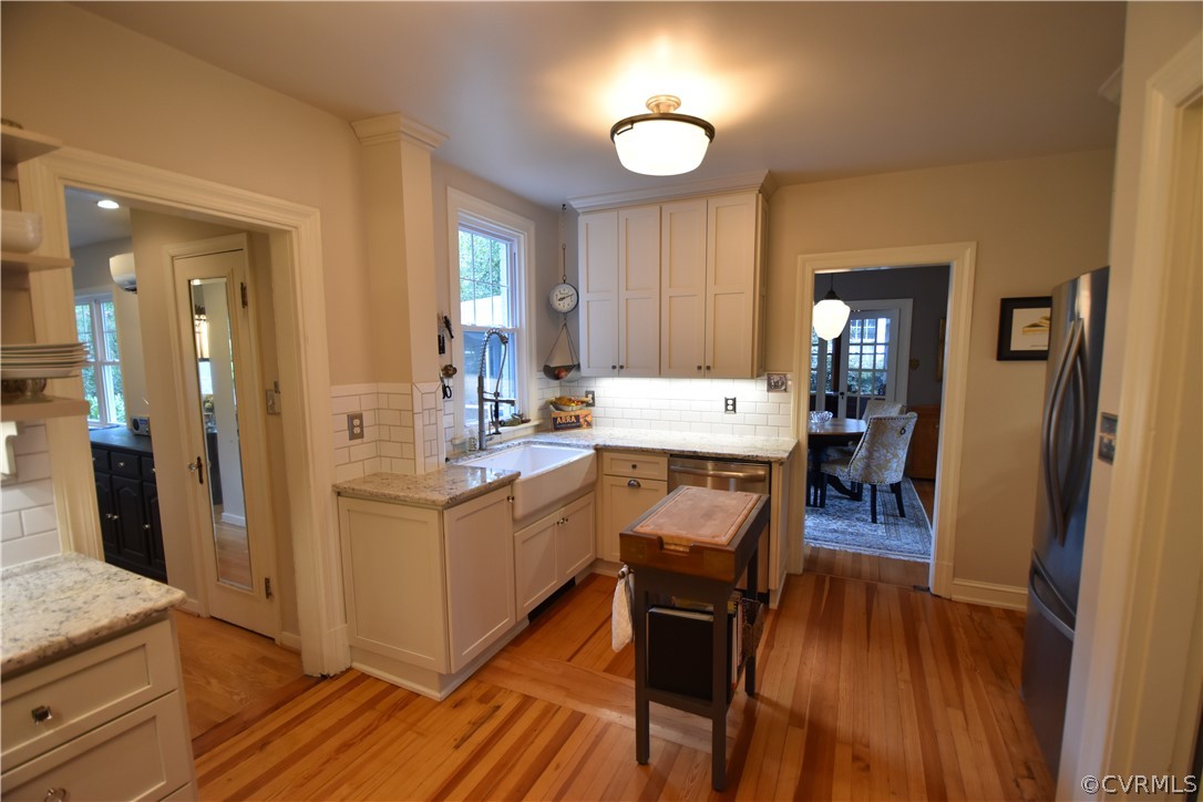 4227 Brook Road Richmond, VA 23227 - Photo 17 of 41 a view of living room and kitchen with wooden floor