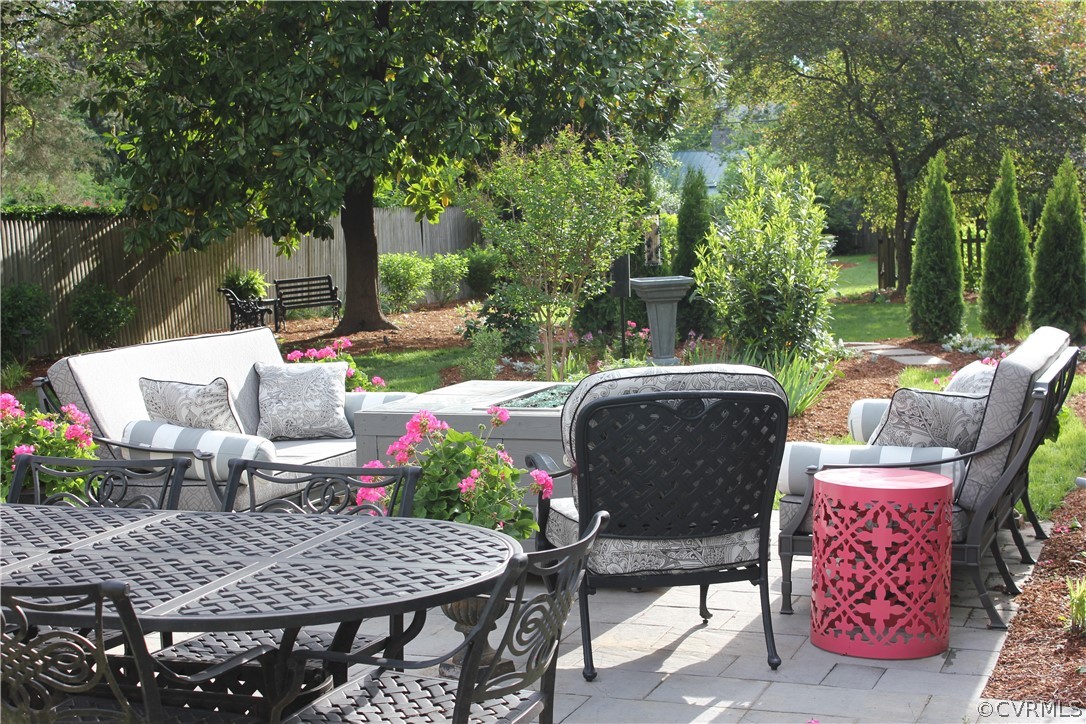 4227 Brook Road Richmond, VA 23227 - Photo 32 of 41 a view of a patio with a table chairs and a potted plant