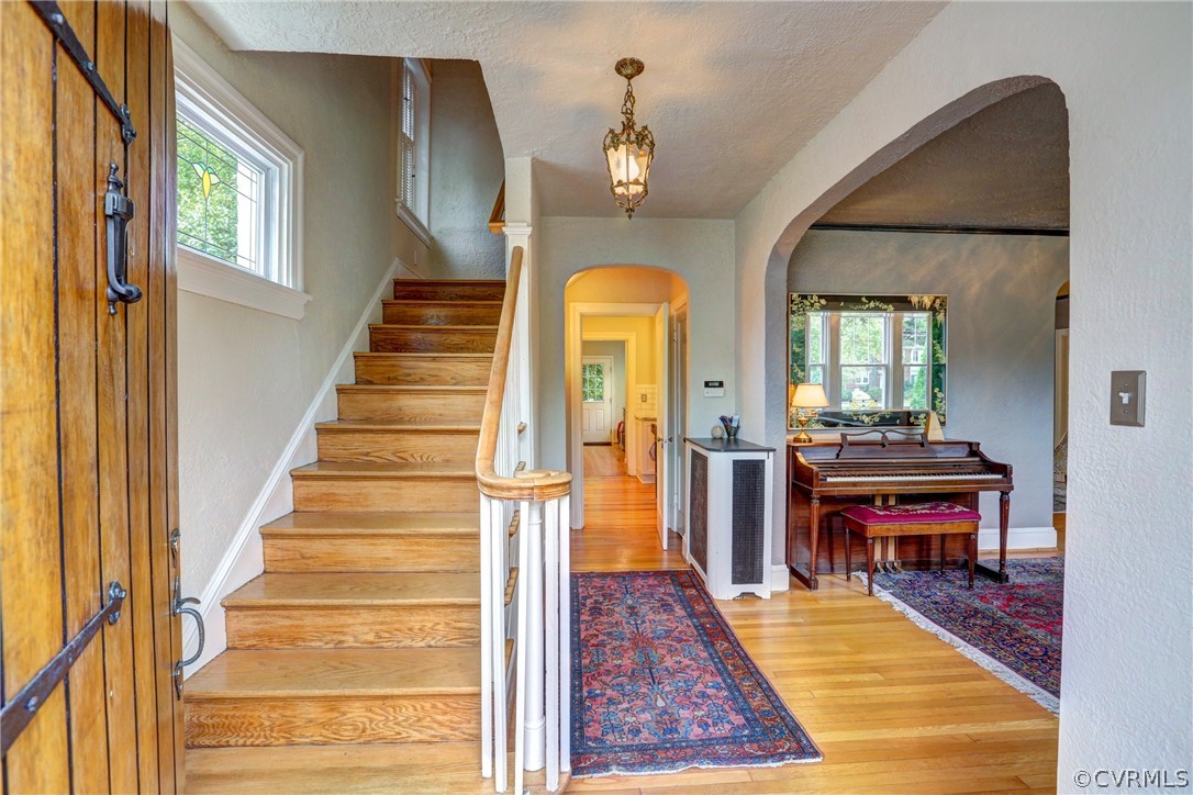 4227 Brook Road Richmond, VA 23227 - Photo 4 of 41 a view of an entryway with wooden floor and a chandelier
