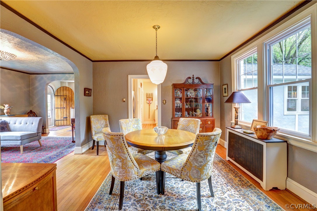 4227 Brook Road Richmond, VA 23227 - Photo 8 of 41 a dining room with furniture a chandelier and wooden floor