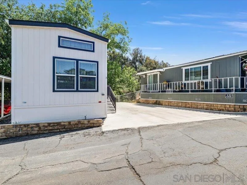 14291 Rios Canyon Road, Unit 3 El Cajon, CA 92021 - Photo 5 of 16 a front view of a house with a yard