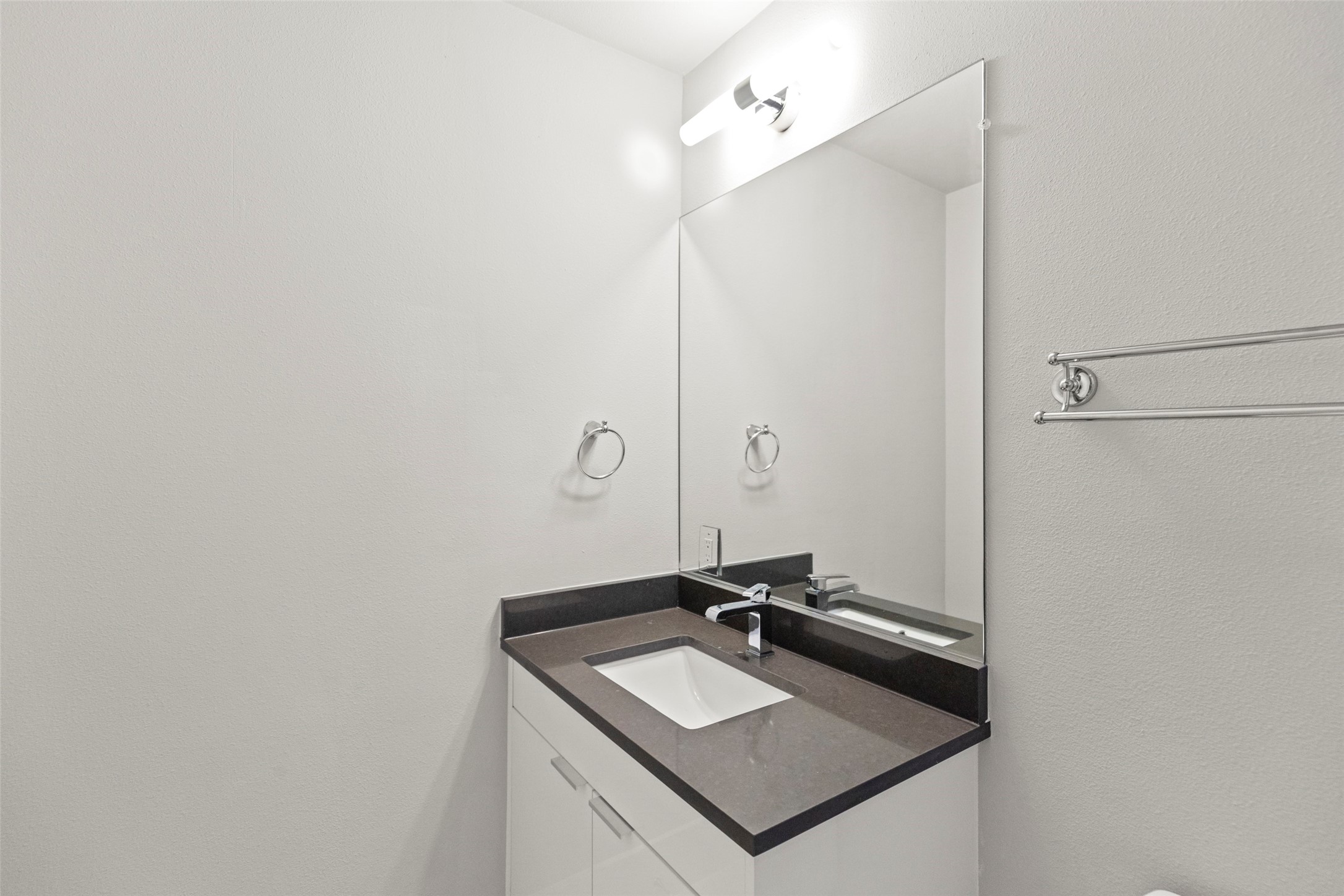 1613 Wheeler Avenue, Unit A Houston, TX 77004 - Photo 17 of 32 a bathroom with a sink and a mirror