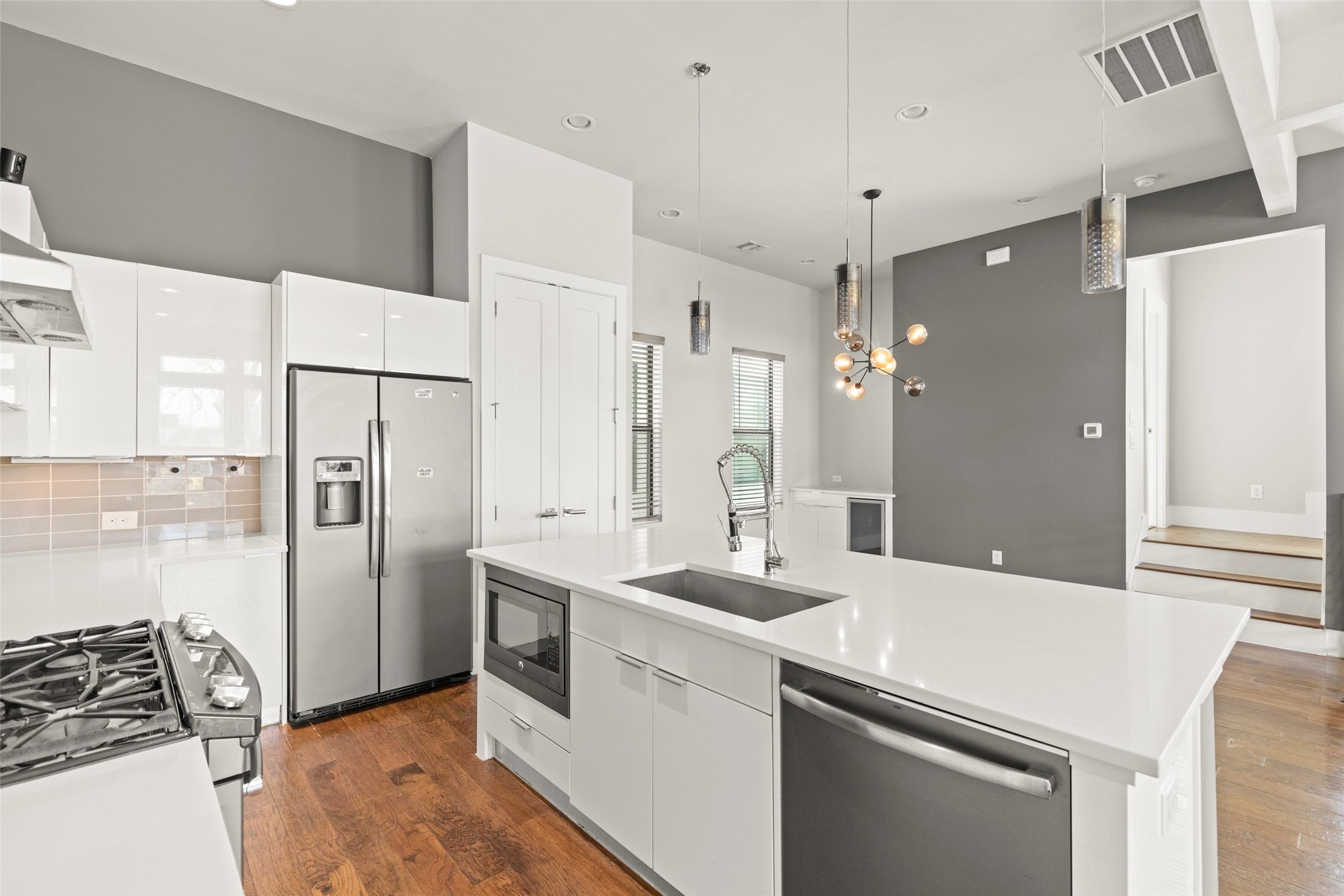 1613 Wheeler Avenue, Unit A Houston, TX 77004 - Photo 2 of 32 a kitchen with a sink appliances and cabinets