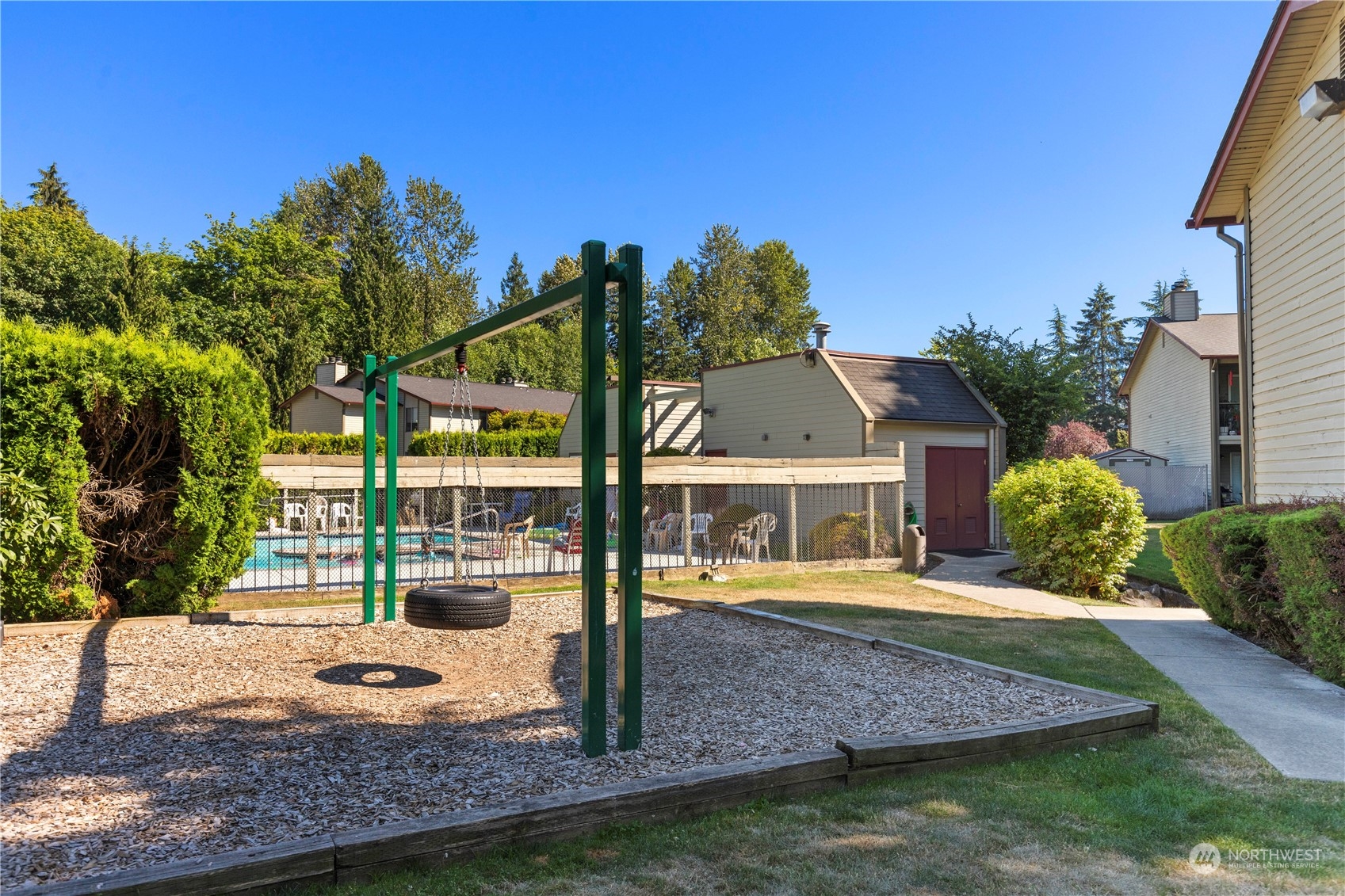 17522 151st Avenue Southeast, Unit 31 Renton, WA 98058 - Photo 31 of 37 a front view of a house with garden