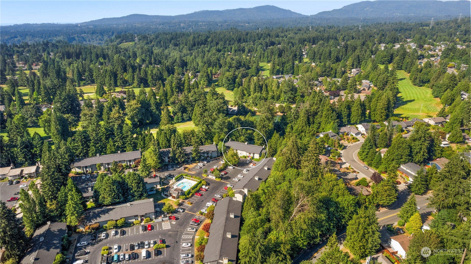 17522 151st Avenue Southeast, Unit 31 Renton, WA 98058 - Photo 35 of 37 a view of a lush green field with lots of bushes