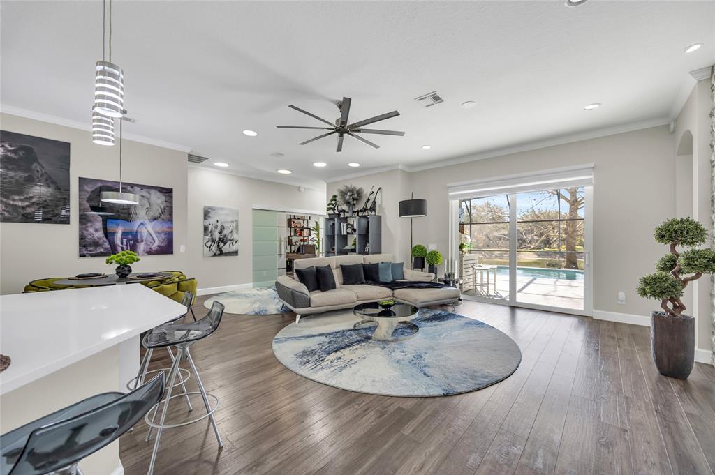 10600 Oakview Pointe Terrace Gotha, FL 34734 - Photo 14 of 44 a living room with furniture a dining table and a potted plant