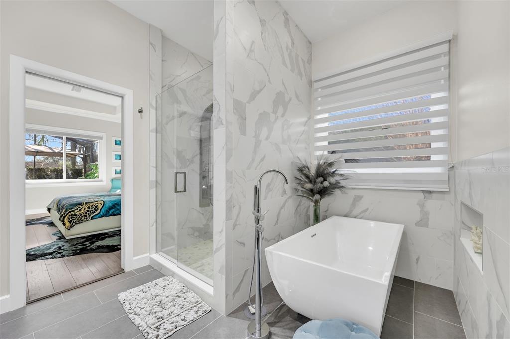 10600 Oakview Pointe Terrace Gotha, FL 34734 - Photo 18 of 44 a bathroom with a tub and a shower