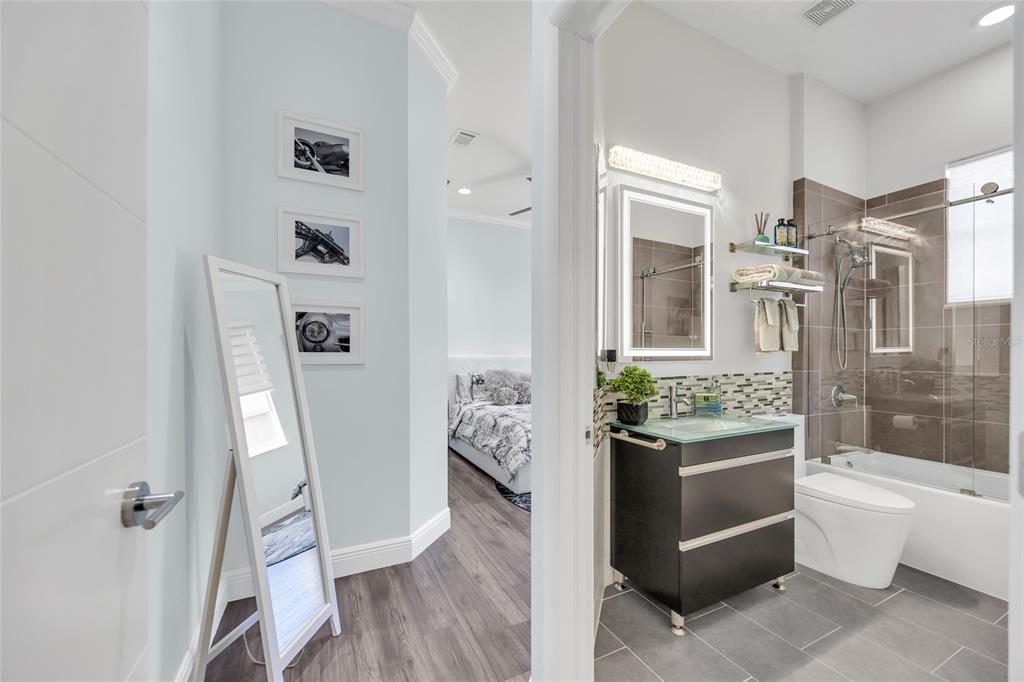 10600 Oakview Pointe Terrace Gotha, FL 34734 - Photo 24 of 44 a bathroom with a granite countertop sink toilet and shower