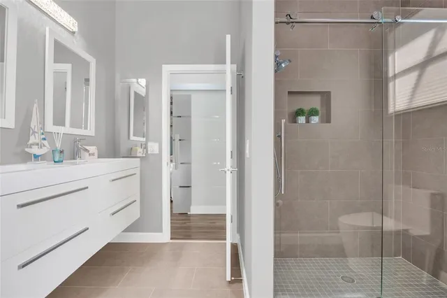 a bathroom with a shower and a sink