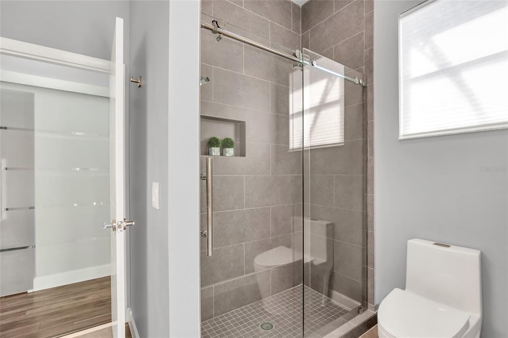 10600 Oakview Pointe Terrace Gotha, FL 34734 - Photo 29 of 44 a bathroom with a toilet and a shower