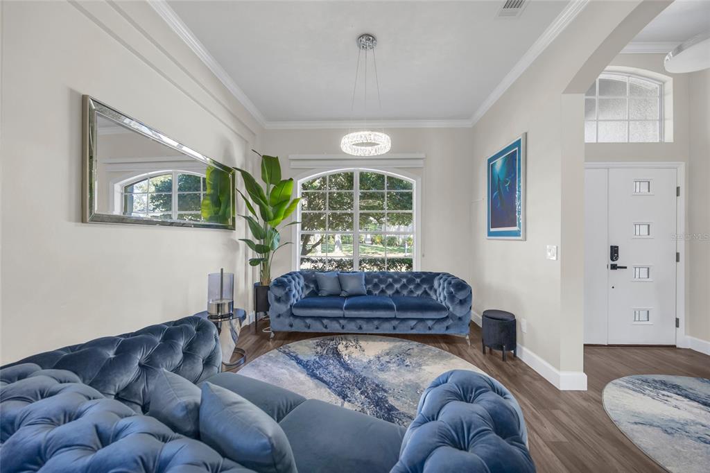 10600 Oakview Pointe Terrace Gotha, FL 34734 - Photo 6 of 44 a living room with furniture and a large window