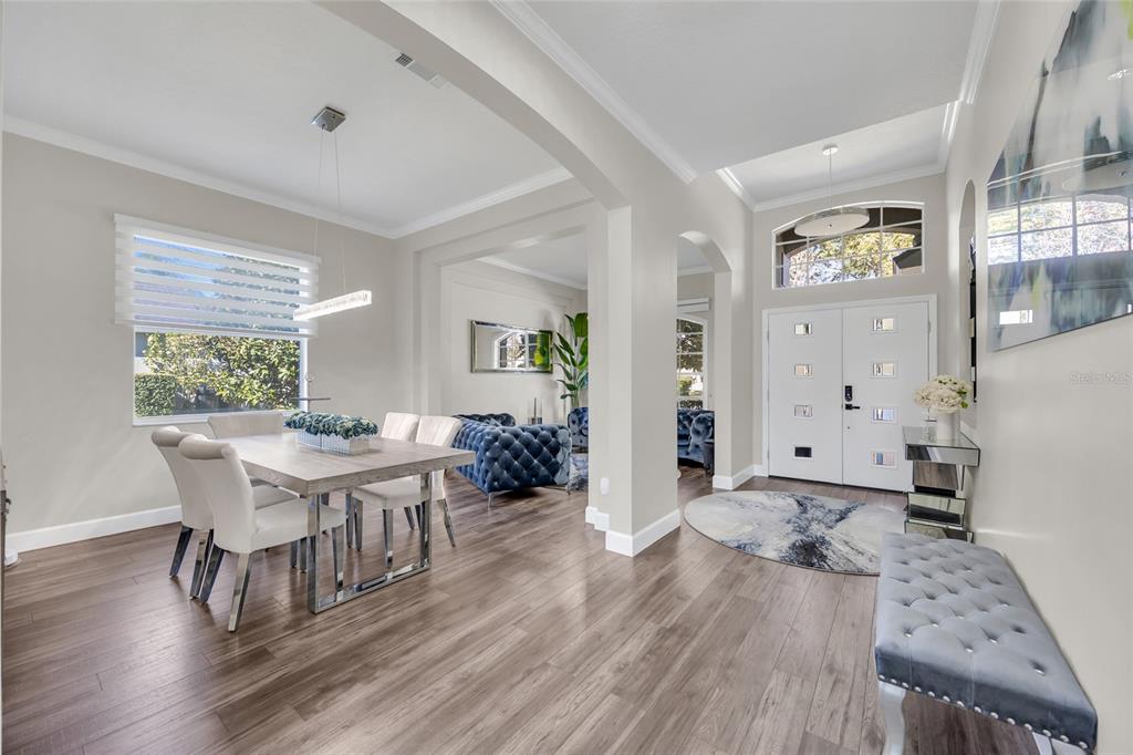 10600 Oakview Pointe Terrace Gotha, FL 34734 - Photo 7 of 44 a view of a dining room with furniture and wooden floor