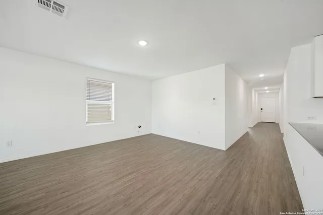 a view of a livingroom with wooden floor
