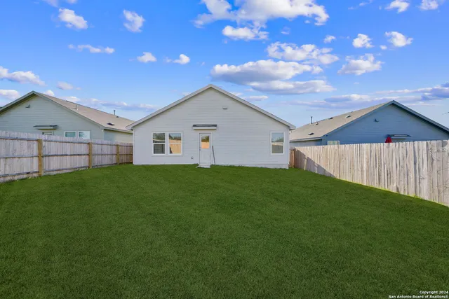 a view of a backyard with a garden