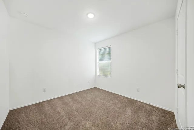 an empty room with a empty space and window