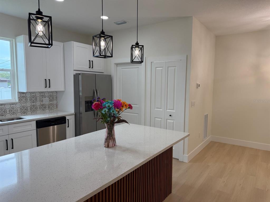 126 Canby Circle Spring Hill, FL 34606 - Photo 18 of 45 a kitchen with a refrigerator and sink