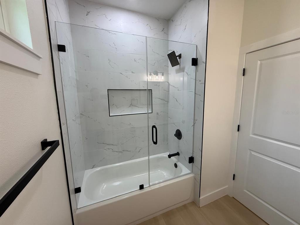 126 Canby Circle Spring Hill, FL 34606 - Photo 29 of 45 a bathroom with a bathtub