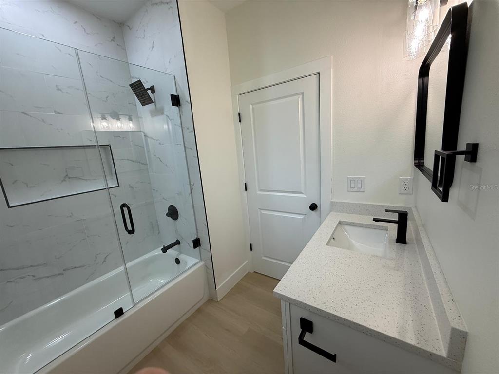 126 Canby Circle Spring Hill, FL 34606 - Photo 36 of 45 a bathroom with a sink and a shower