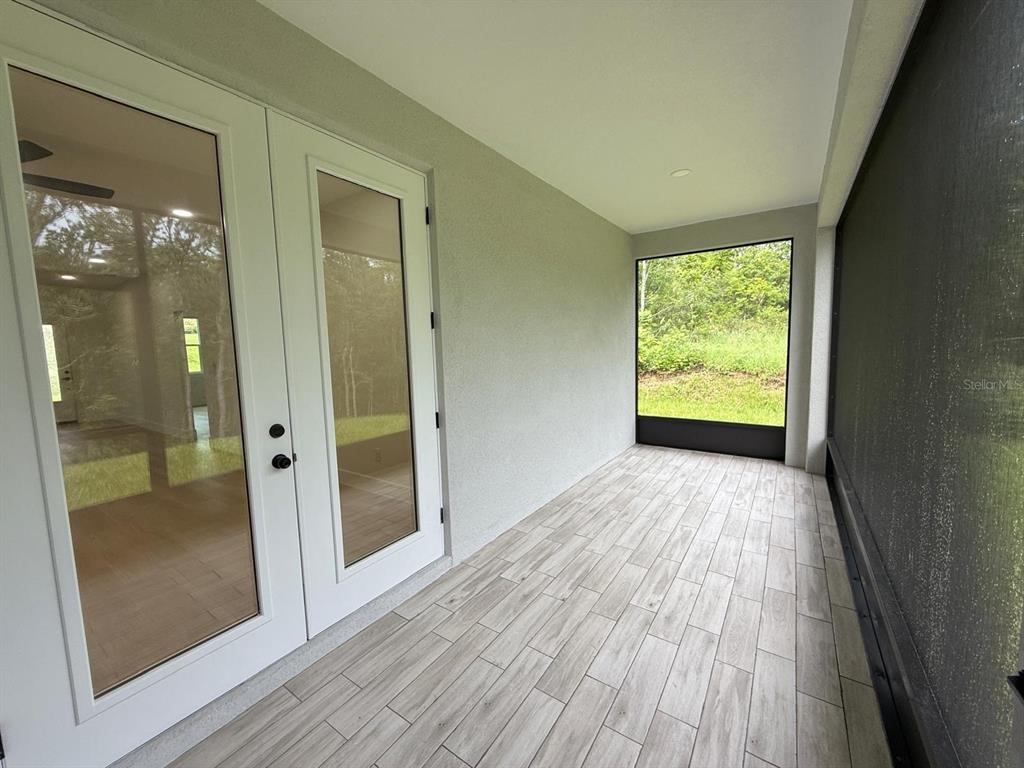 126 Canby Circle Spring Hill, FL 34606 - Photo 45 of 45 a view of hallway with a wooden floor