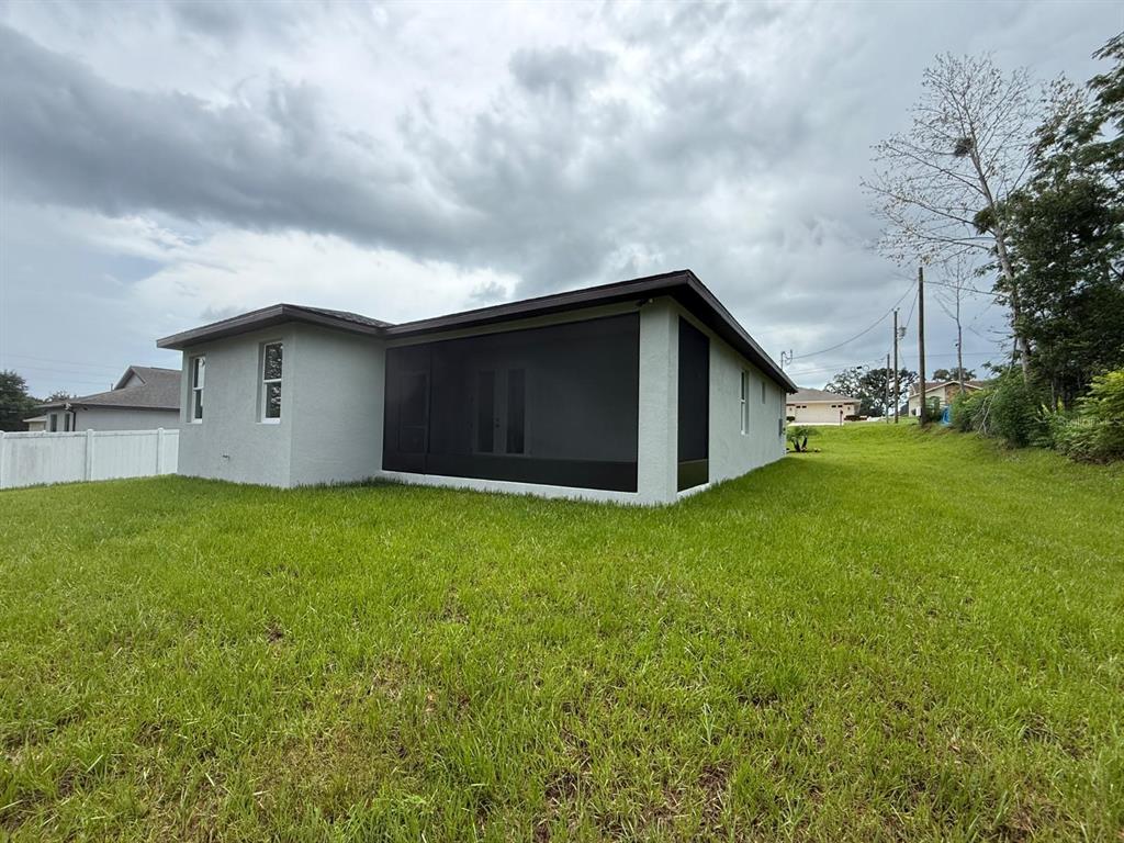 126 Canby Circle Spring Hill, FL 34606 - Photo 8 of 45 a house view with a garden space