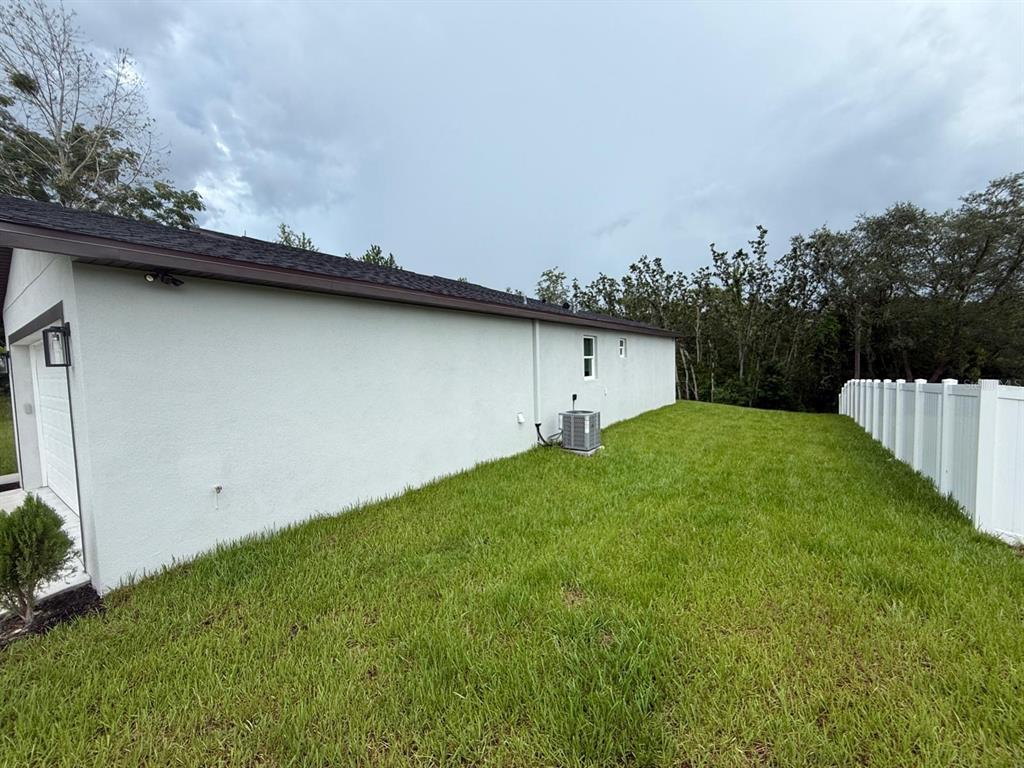 126 Canby Circle Spring Hill, FL 34606 - Photo 9 of 45 a view of outdoor space and yard