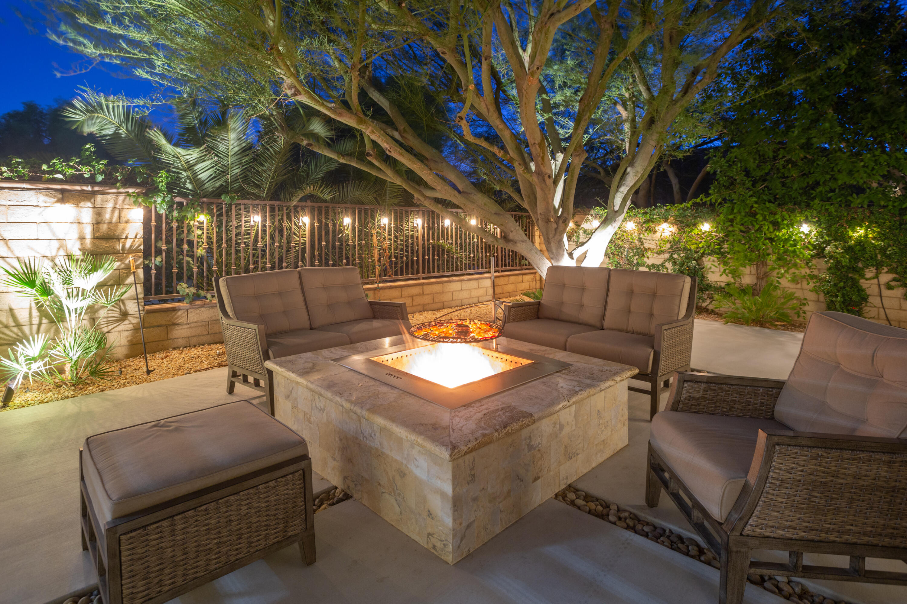 79120 Shadow Trail La Quinta, CA 92253 - Photo 11 of 60 a backyard of a house with table and chairs
