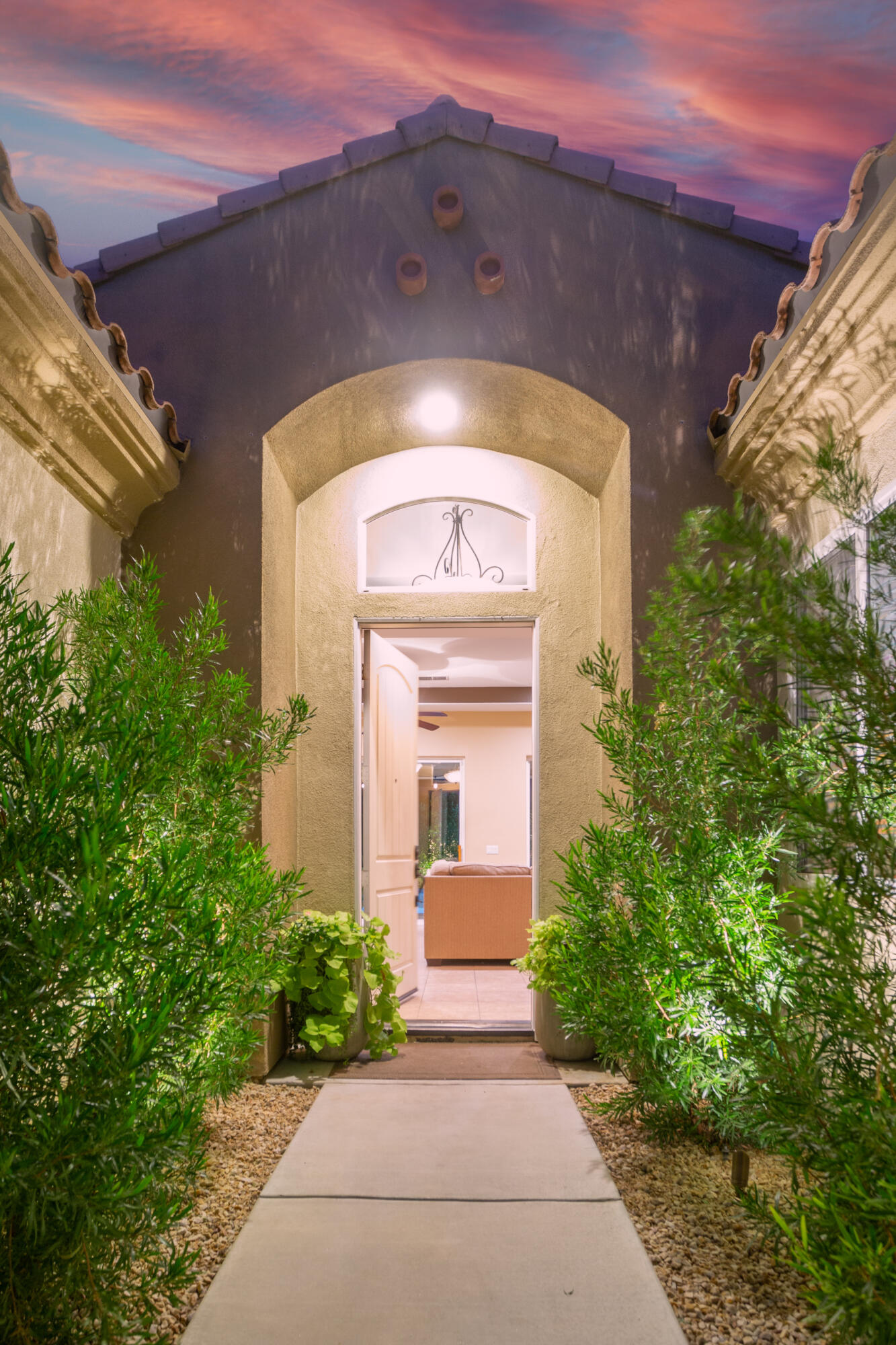 79120 Shadow Trail La Quinta, CA 92253 - Photo 15 of 60 a front view of a house with garden