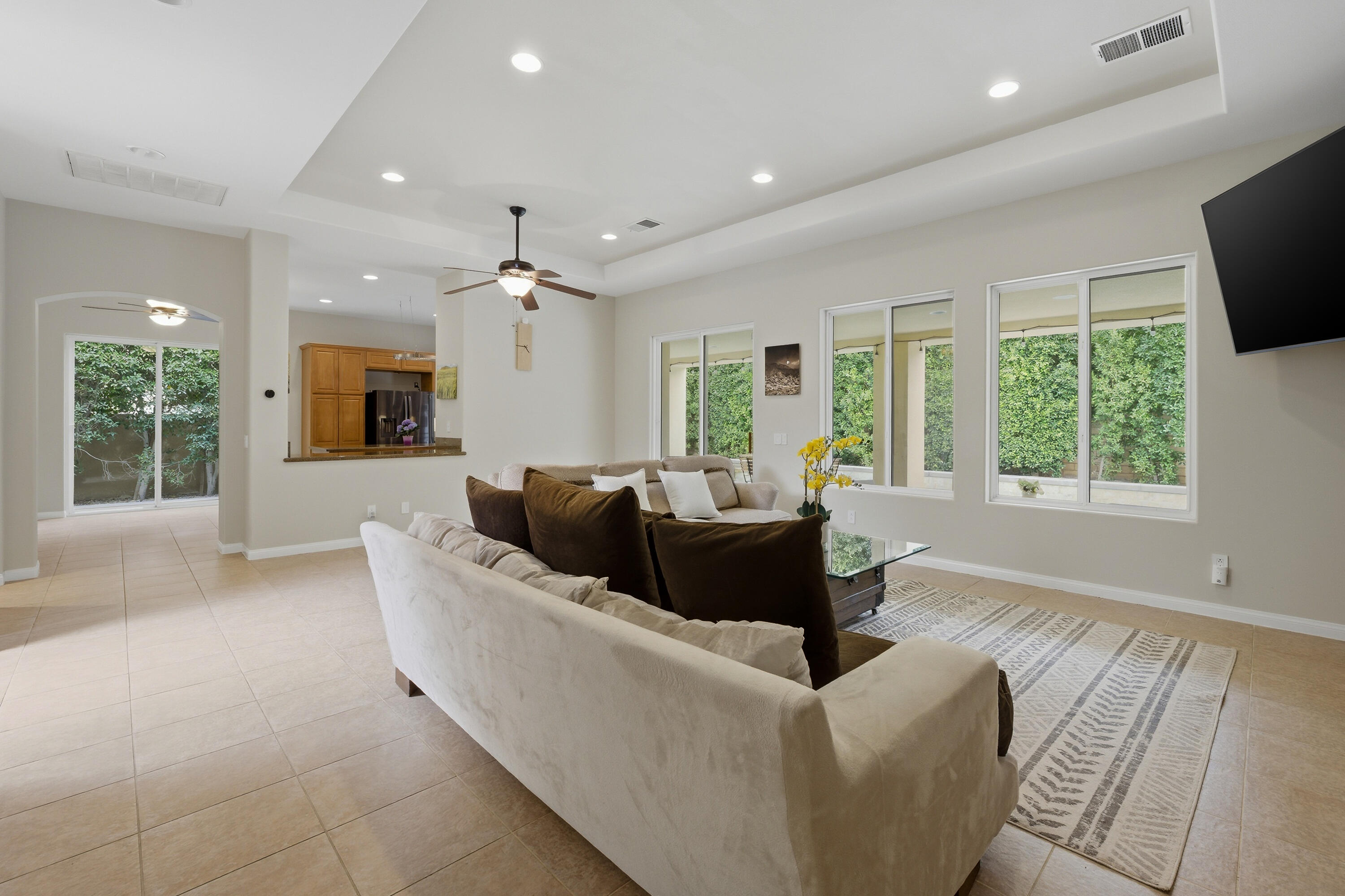 79120 Shadow Trail La Quinta, CA 92253 - Photo 22 of 60 a living room with furniture and a large window