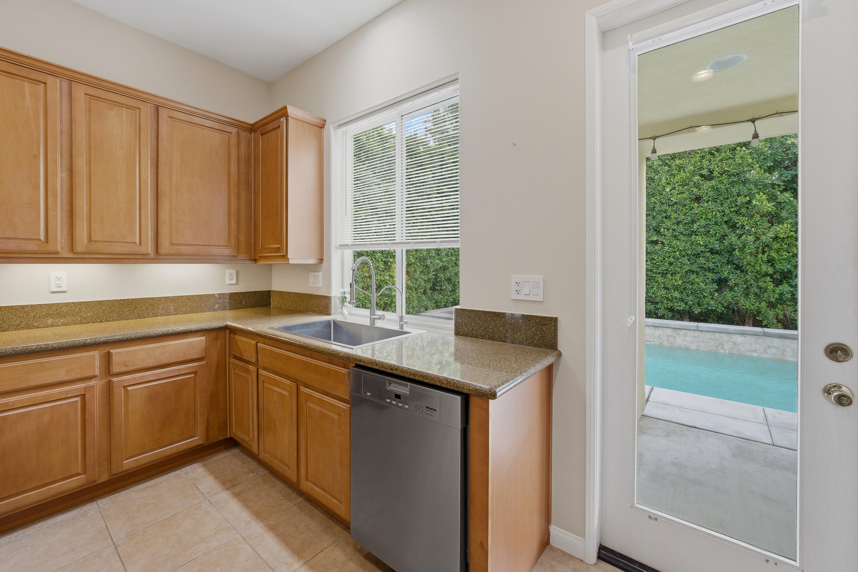 79120 Shadow Trail La Quinta, CA 92253 - Photo 31 of 60 a kitchen with a sink and a window