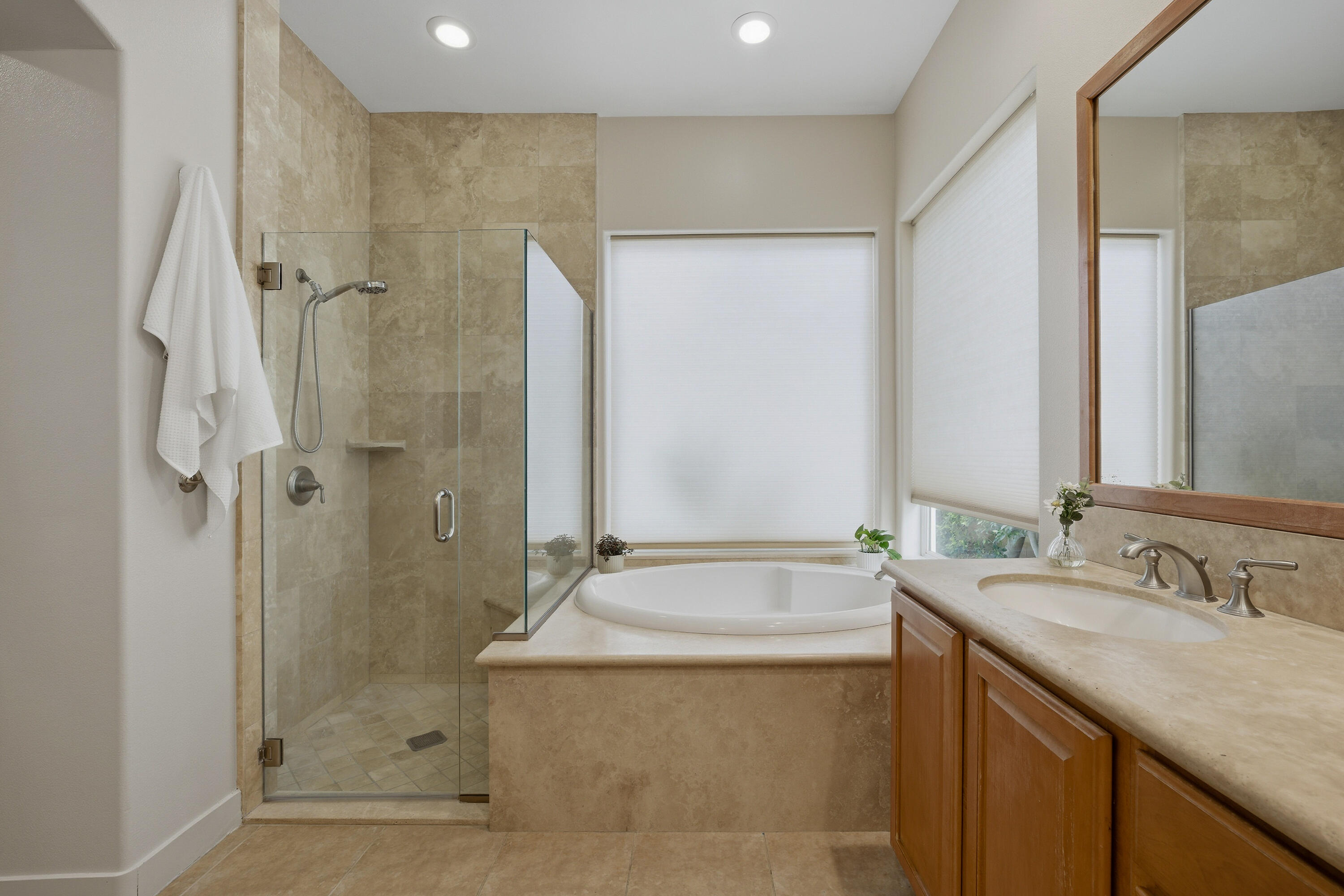 79120 Shadow Trail La Quinta, CA 92253 - Photo 38 of 60 a bathroom with a granite countertop sink a shower and a mirror