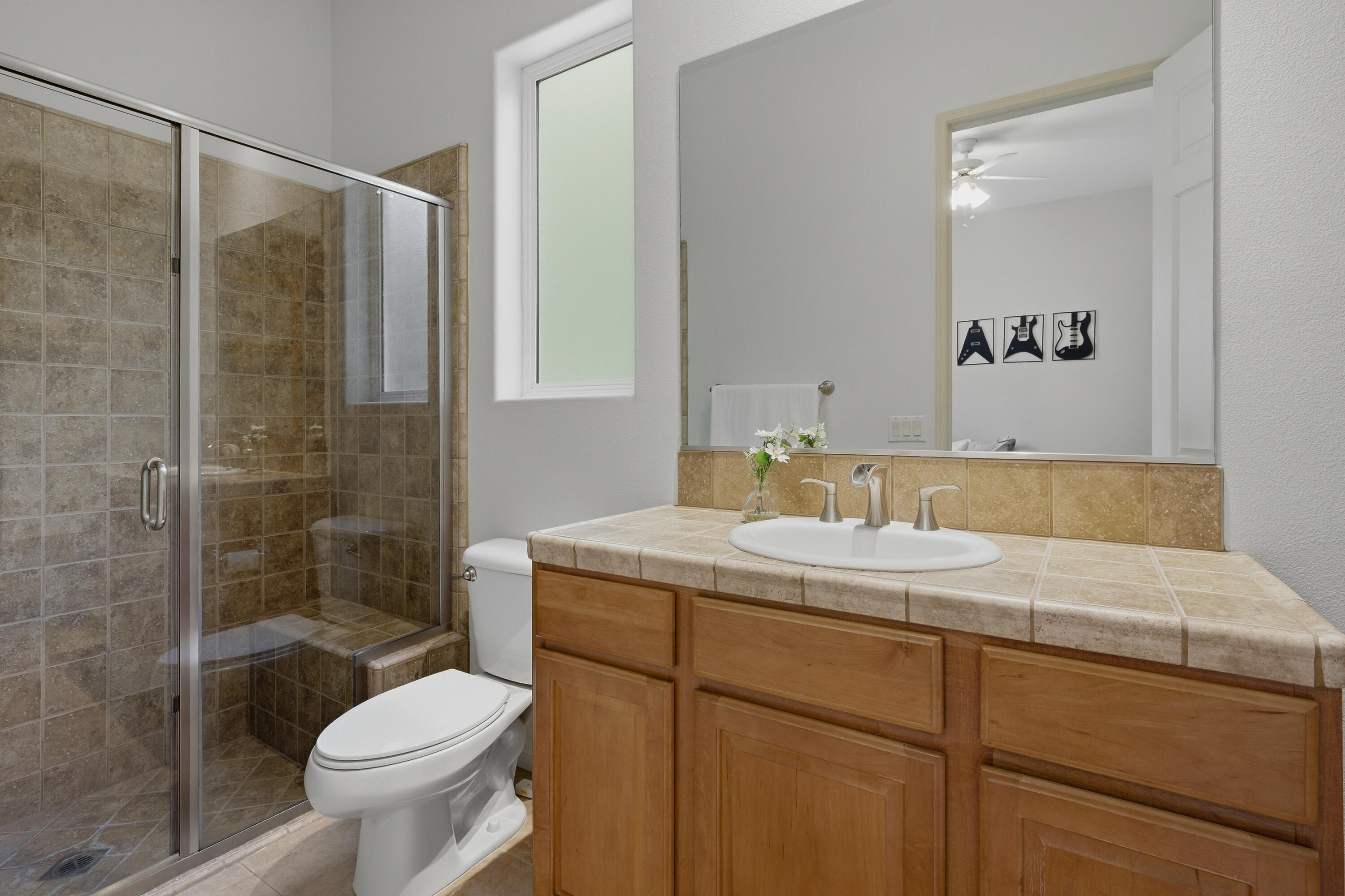 79120 Shadow Trail La Quinta, CA 92253 - Photo 42 of 60 a bathroom with a sink toilet and shower