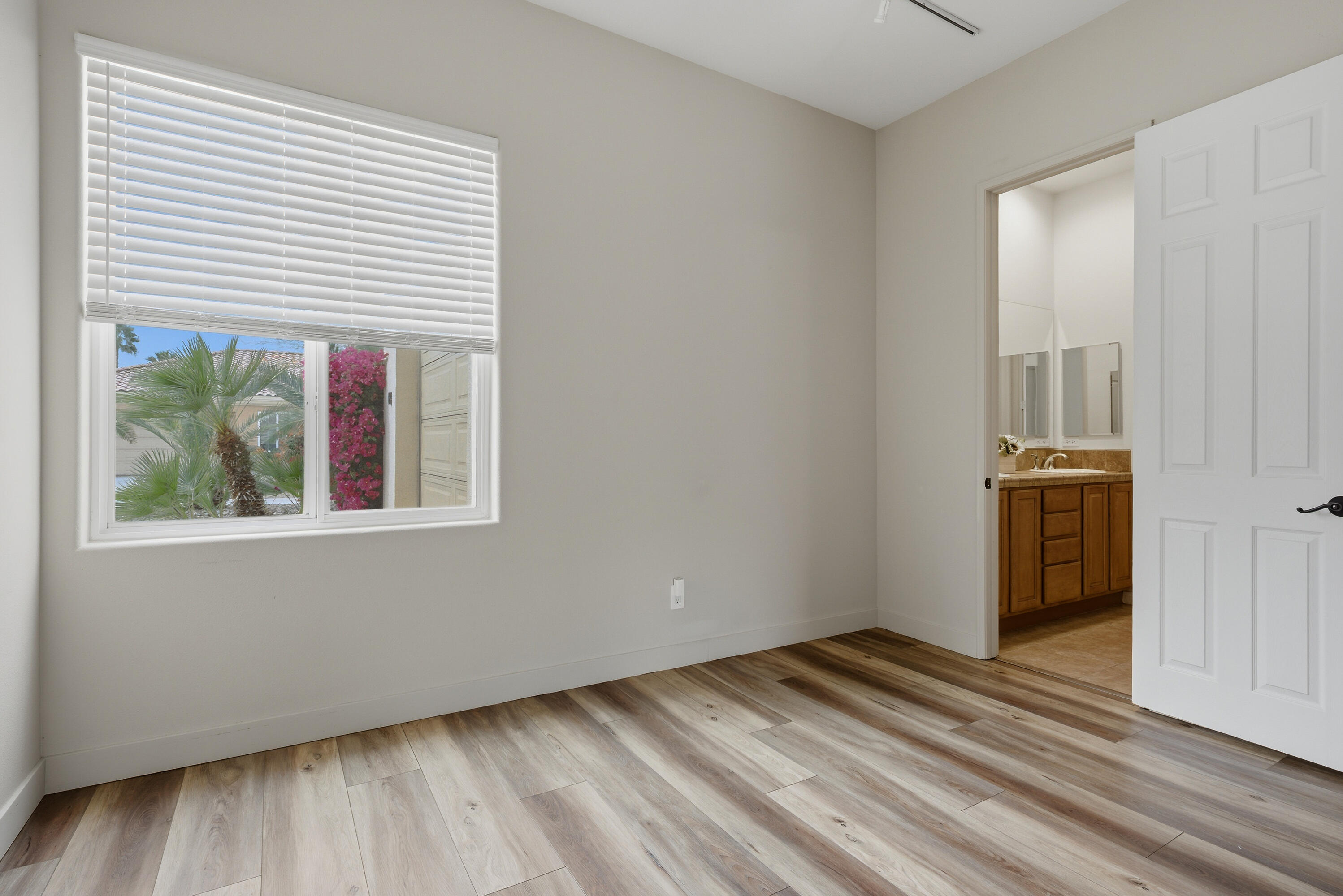 79120 Shadow Trail La Quinta, CA 92253 - Photo 43 of 60 a view of a room with wooden floor and a window