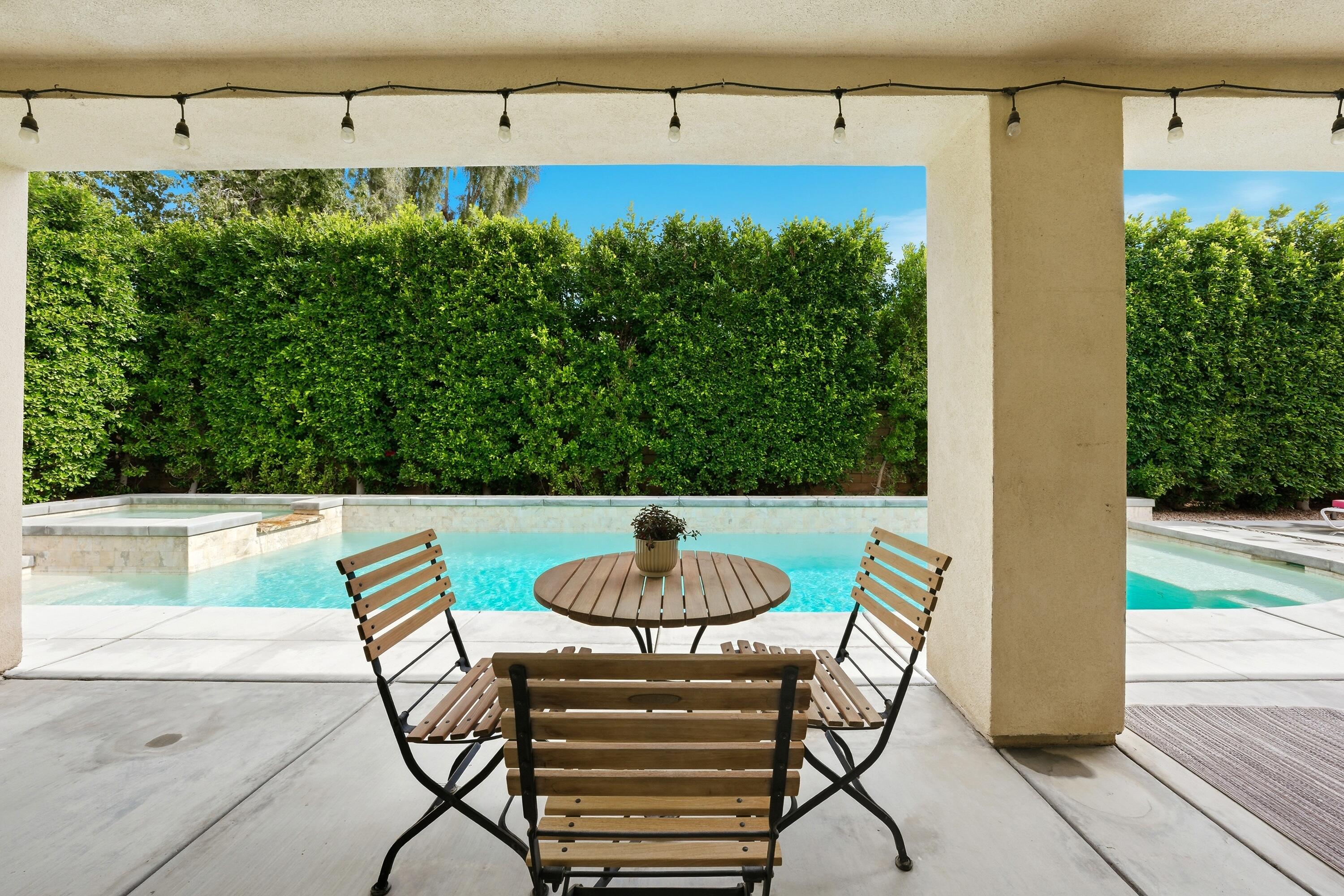 79120 Shadow Trail La Quinta, CA 92253 - Photo 52 of 60 a view of a balcony with table and chairs