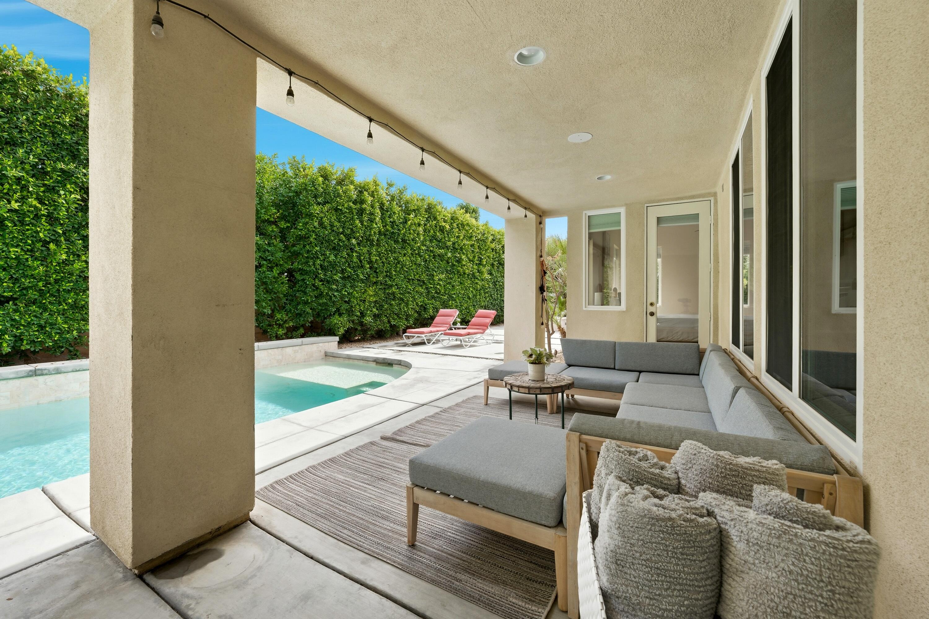 79120 Shadow Trail La Quinta, CA 92253 - Photo 53 of 60 a living room with furniture and a large window