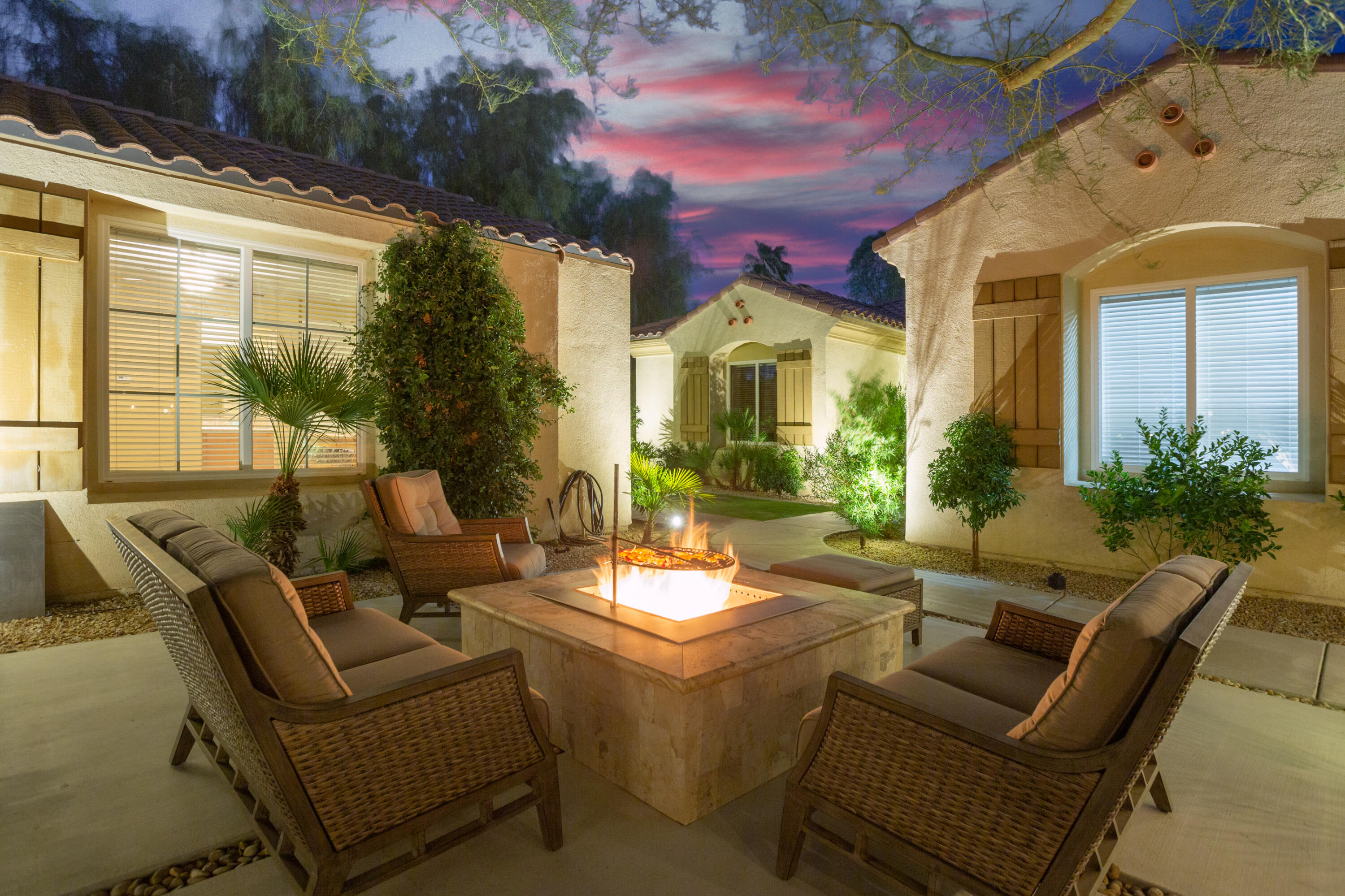 79120 Shadow Trail La Quinta, CA 92253 - Photo 9 of 60 a view of a patio with couches table and chairs with wooden floor and fence