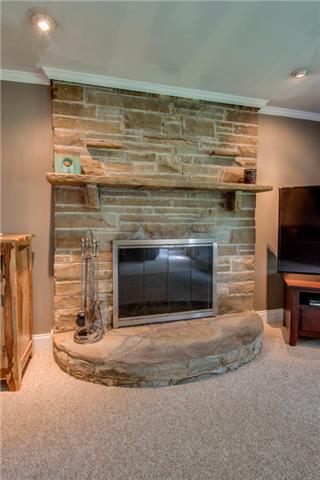 477 Franklin Limestone Road Nashville, TN 37217 - Photo 5 of 19 Floor to Ceiling Stone Fireplace makes a great statement in the Living Room.