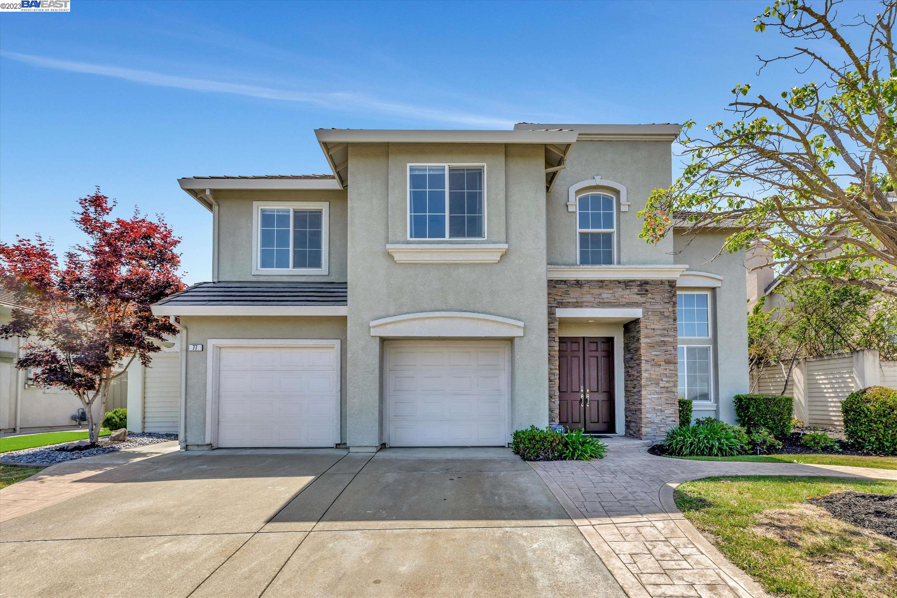 a front view of a house with yard