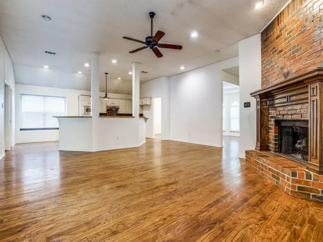 a view of a kitchen with a stove cabinets and wooden floor