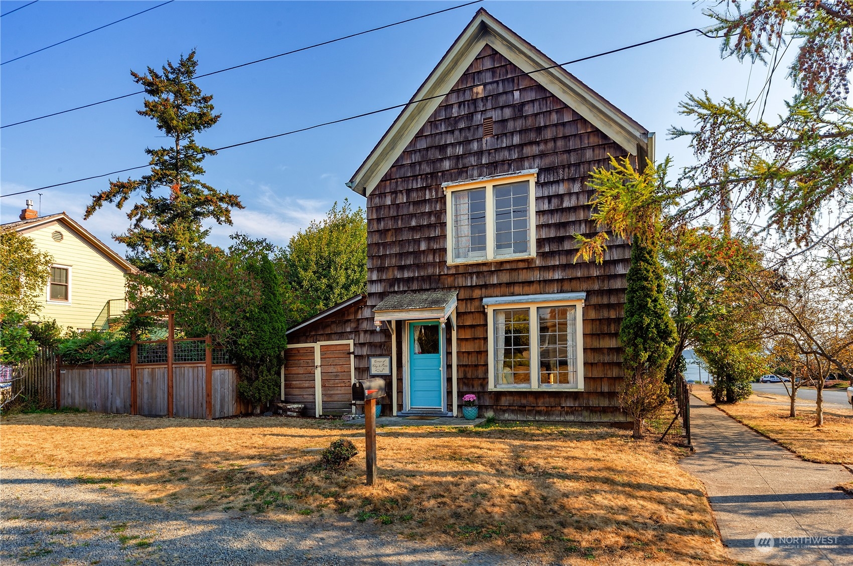 1441 Clay Street Port Townsend, WA 98368 - Photo 2 of 26 a front view of a house with a yard
