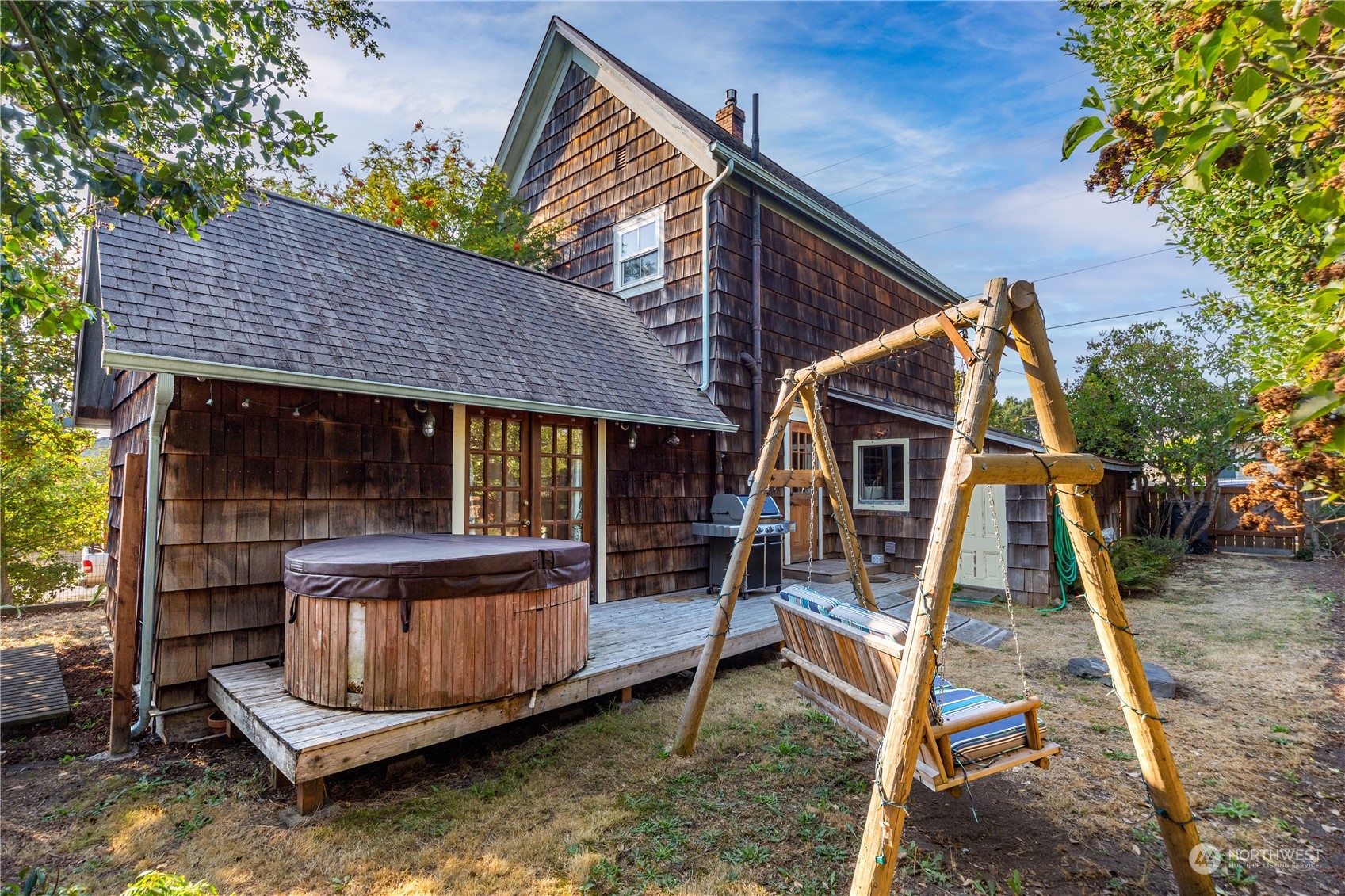 1441 Clay Street Port Townsend, WA 98368 - Photo 23 of 26 a view of a house with a wooden deck and a chair