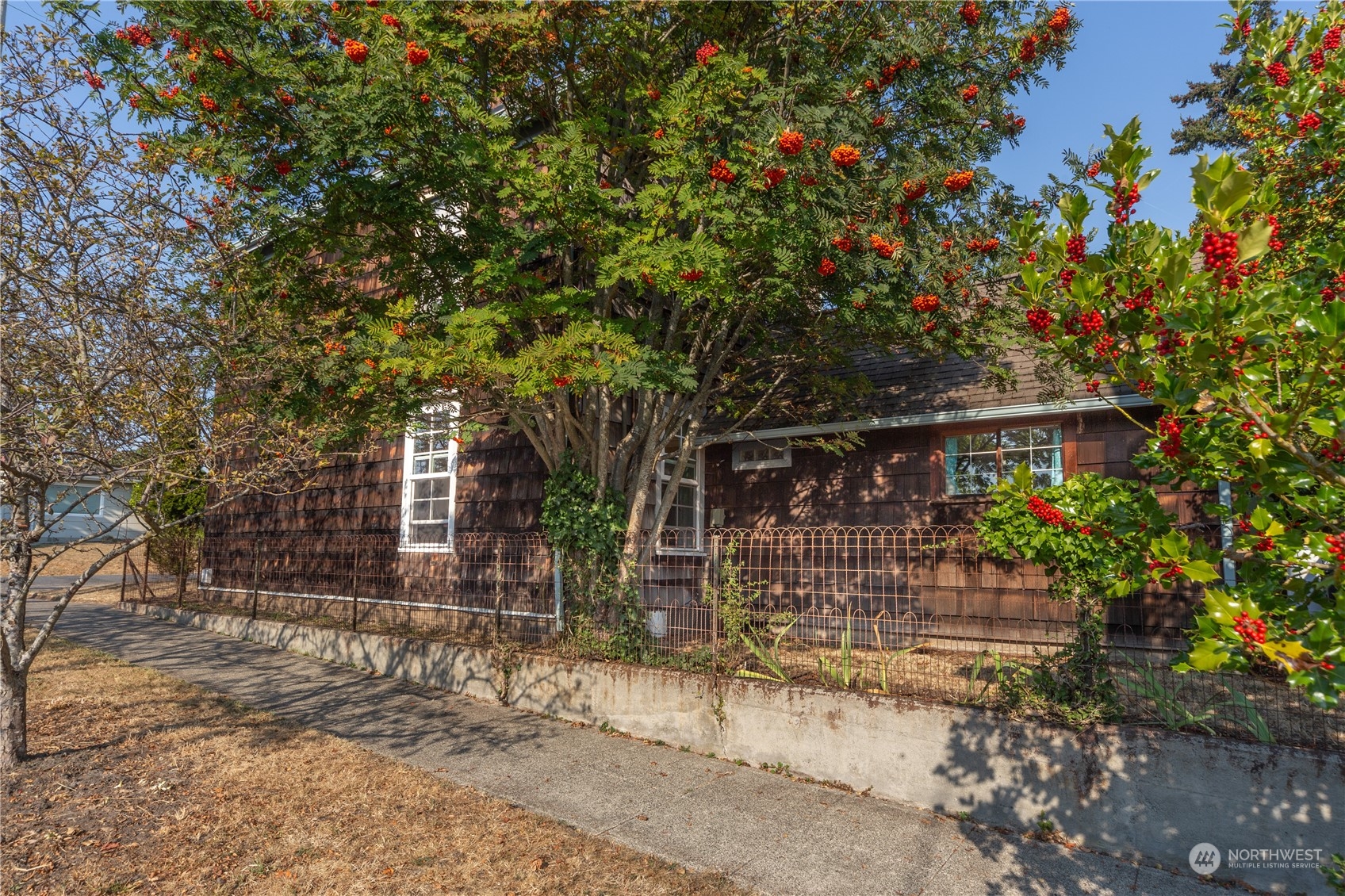 1441 Clay Street Port Townsend, WA 98368 - Photo 26 of 26 a front view of a house with garden