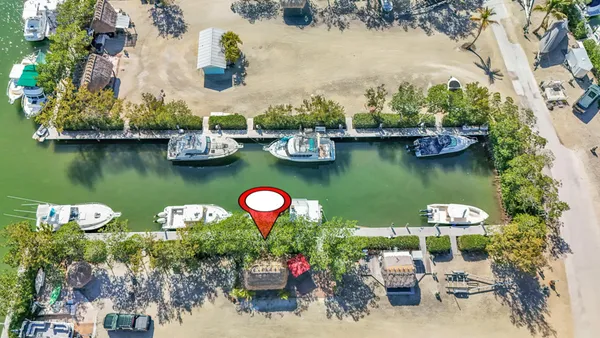 a view of a table and chairs in the lake