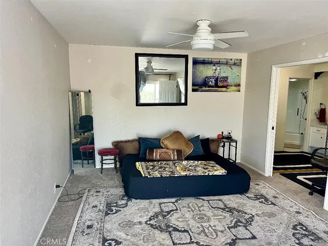 a living room with furniture and a rug