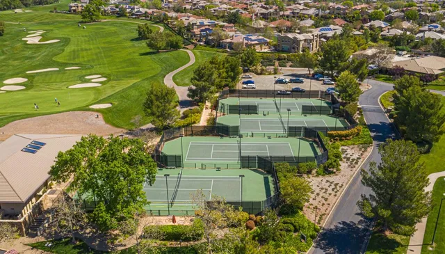 an aerial view of a residential houses with outdoor space