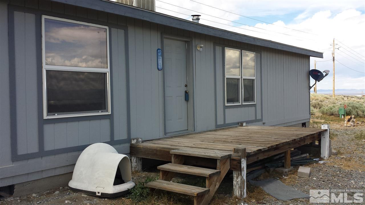 209 Kingston Road Kingston, NV 89310 - Photo 1 of 1 a dinning table sitting in front of a house
