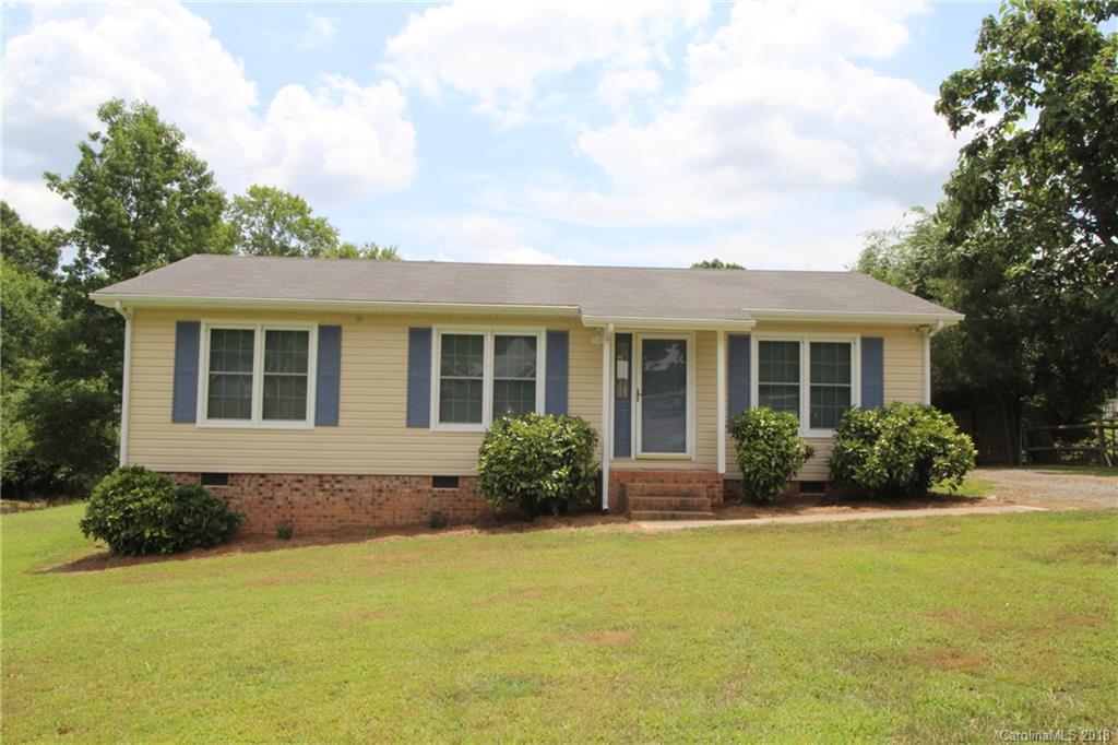 1715 Carmel Church Road, Unit 2 Monroe, NC 28112 - Photo 1 of 19 a front view of a house with yard and porch
