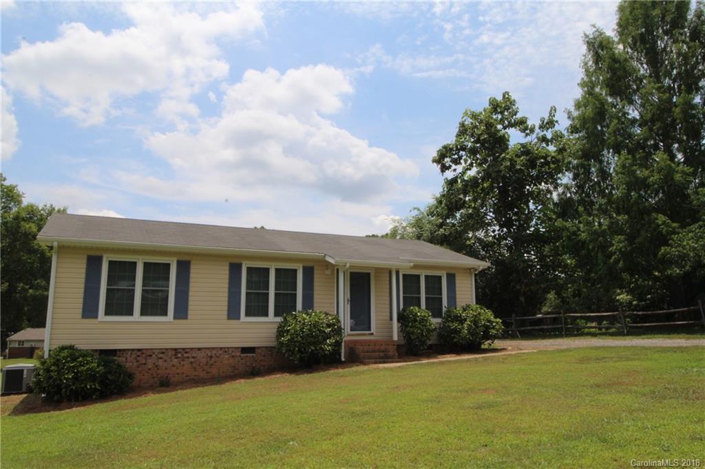 1715 Carmel Church Road, Unit 2 Monroe, NC 28112 - Photo 2 of 19 a front view of a house with a garden