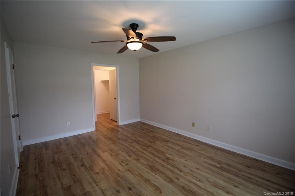 1715 Carmel Church Road, Unit 2 Monroe, NC 28112 - Photo 15 of 19 a view of an empty room with wooden floor