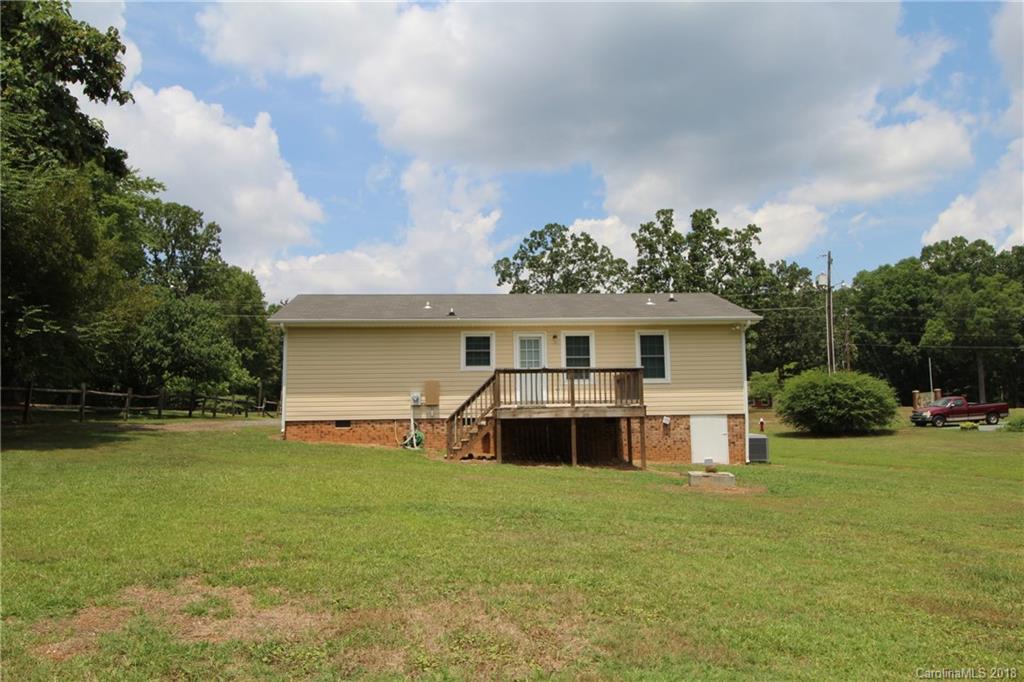1715 Carmel Church Road, Unit 2 Monroe, NC 28112 - Photo 19 of 19 a view of a house with a yard and sitting area
