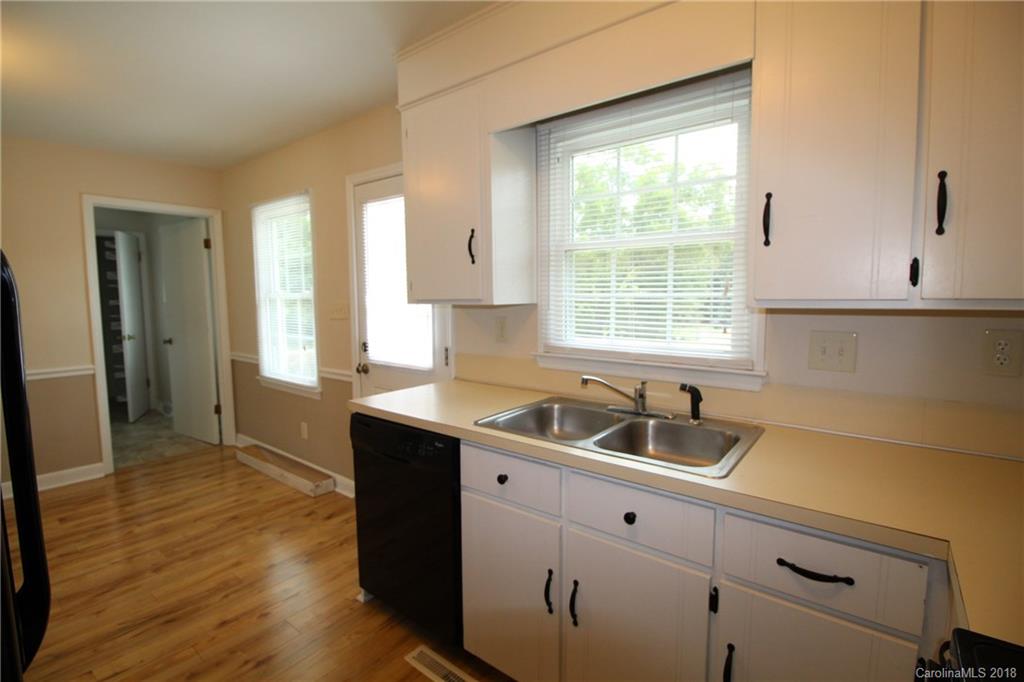 1715 Carmel Church Road, Unit 2 Monroe, NC 28112 - Photo 5 of 19 a kitchen with a sink and cabinets